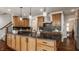 Modern kitchen with large island, granite counters and stainless steel appliances at 8235 Ridge Valley Ct, Indianapolis, IN 46278