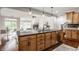 Modern kitchen with island, granite counters and stainless steel appliances at 8235 Ridge Valley Ct, Indianapolis, IN 46278