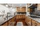 Modern kitchen with light wood cabinets, granite counters and stainless steel appliances at 8235 Ridge Valley Ct, Indianapolis, IN 46278