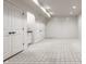 Unfinished basement with white walls, carpet, and double doors at 8235 Ridge Valley Ct, Indianapolis, IN 46278