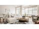 Open living room with sectional sofa, large windows, and ample natural light at 8235 Ridge Valley Ct, Indianapolis, IN 46278
