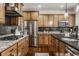Modern kitchen with stainless steel appliances and light wood cabinets at 8235 Ridge Valley Ct, Indianapolis, IN 46278