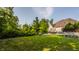 Large backyard with grassy area and stone retaining walls at 8235 Ridge Valley Ct, Indianapolis, IN 46278