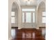 Grand entryway with hardwood floors and arched doorways at 8235 Ridge Valley Ct, Indianapolis, IN 46278