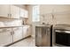 Laundry room with white cabinets, LG washer and dryer at 8235 Ridge Valley Ct, Indianapolis, IN 46278