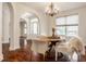 Bright dining room with hardwood floors and a round table at 8235 Ridge Valley Ct, Indianapolis, IN 46278