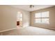 Bedroom with carpet, arched entryway to bathroom, and window at 8235 Ridge Valley Ct, Indianapolis, IN 46278