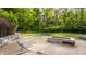 Landscaped backyard with fire pit and retaining walls at 8235 Ridge Valley Ct, Indianapolis, IN 46278