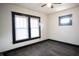 Bedroom with dark hardwood floors and large window at 526 N Emerson Ave, Indianapolis, IN 46219