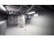 Unfinished basement with water heater and exposed pipes at 526 N Emerson Ave, Indianapolis, IN 46219