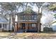 Two-story house with a porch and landscaping at 526 N Emerson Ave, Indianapolis, IN 46219