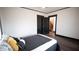 Bedroom with a bed, dark hardwood floors, and ceiling fan at 526 N Emerson Ave, Indianapolis, IN 46219