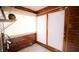 Sunroom with wood walls, blinds, and double doors at 526 N Emerson Ave, Indianapolis, IN 46219