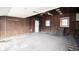 Empty garage with wooden walls and concrete floor at 526 N Emerson Ave, Indianapolis, IN 46219