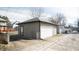 Tan colored garage with a white door at 526 N Emerson Ave, Indianapolis, IN 46219