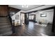 Living room with dark hardwood floors and a view of the kitchen at 526 N Emerson Ave, Indianapolis, IN 46219