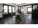 Dining area with a glass-top table and black chairs at 526 N Emerson Ave, Indianapolis, IN 46219