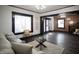 Spacious living room features hardwood floors, large windows, and a cozy seating area at 526 N Emerson Ave, Indianapolis, IN 46219