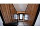 Upper level staircase with wood paneling and window at 526 N Emerson Ave, Indianapolis, IN 46219