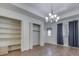 Dining room with hardwood floors, built-in shelving, and a chandelier at 556 Silver Fox Ct, Indianapolis, IN 46217