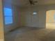 Bright living room featuring a window and entryway at 209 Pennsylvania St, Shirley, IN 47384