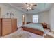 Bright main bedroom with king-size bed and ceiling fan at 8157 Center Lake Rd, Nineveh, IN 46164