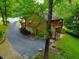 Aerial view of a house with a driveway and lush green surroundings at 8157 Center Lake Rd, Nineveh, IN 46164