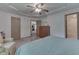 Main bedroom with large bed and access to bathroom at 8157 Center Lake Rd, Nineveh, IN 46164