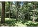 Wooded area behind the property, offering a private and secluded setting at 8157 Center Lake Rd, Nineveh, IN 46164
