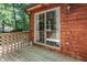 Wooden deck with sliding glass door leading to the home at 8157 Center Lake Rd, Nineveh, IN 46164