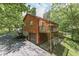 Wooden house with a deck, garage, and driveway at 8157 Center Lake Rd, Nineveh, IN 46164