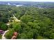 Aerial view of a lake community with lush greenery at 8157 Center Lake Rd, Nineveh, IN 46164