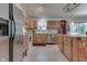 Modern kitchen with stainless steel appliances and wood cabinets at 8157 Center Lake Rd, Nineveh, IN 46164