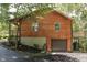 Wooden house with a deck, garage, and driveway at 8157 Center Lake Rd, Nineveh, IN 46164