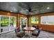 Game room with wood paneling, sliding doors to deck, and a wood table at 4925 S County Road 250 W, Clayton, IN 46118