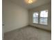 Spacious bedroom with carpet and two windows at 11327 Briargate Dr, Fishers, IN 46040