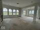 Open concept living and dining area with fireplace and windows at 11327 Briargate Dr, Fishers, IN 46040