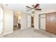 Bedroom with ceiling fan, closet, and access to bathroom at 2719 E 28Th St, Indianapolis, IN 46218