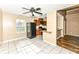 Kitchen and dining area with tile floors and ceiling fan at 2719 E 28Th St, Indianapolis, IN 46218