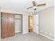 Bedroom with carpeted floor, ceiling fan, and large closet at 2719 E 28Th St, Indianapolis, IN 46218