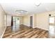 Spacious living room with wood-look floors and sliding glass doors at 2719 E 28Th St, Indianapolis, IN 46218