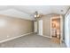 Carpeted bedroom with private bathroom and ceiling fan at 2719 E 28Th St, Indianapolis, IN 46218