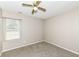 Carpeted bedroom with window and ceiling fan at 2719 E 28Th St, Indianapolis, IN 46218
