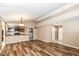 Open concept living room with laminate floors and kitchen view at 2719 E 28Th St, Indianapolis, IN 46218