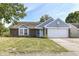 Ranch home with brick and blue siding, attached garage, and lawn at 2719 E 28Th St, Indianapolis, IN 46218