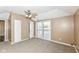 Carpeted bedroom with ceiling fan and sliding glass doors to deck at 2719 E 28Th St, Indianapolis, IN 46218