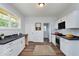 Modern kitchen with white cabinets and dark countertops at 906 N Parker Ave, Indianapolis, IN 46201
