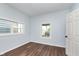 Simple bedroom with hardwood floors and a view of the street at 906 N Parker Ave, Indianapolis, IN 46201