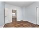 Spacious bedroom with hardwood floors and neutral walls at 906 N Parker Ave, Indianapolis, IN 46201
