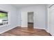 Spacious bedroom with hardwood floors and an open door at 906 N Parker Ave, Indianapolis, IN 46201